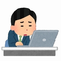 パソコンの前で困った顔をした男性のイラスト